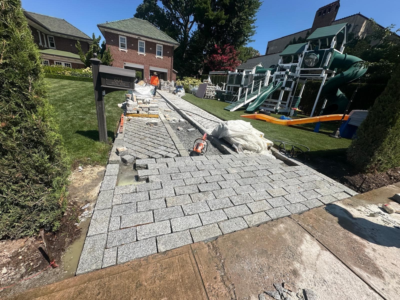 Our stonemasons laying a natural stone walkway