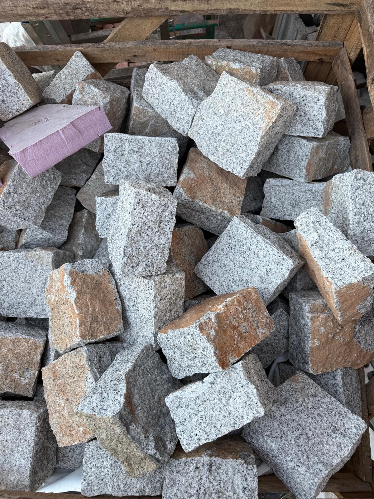 Crate of natural granite cobblestone ready for delivery